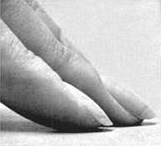 close up of fingers touching a flat surface