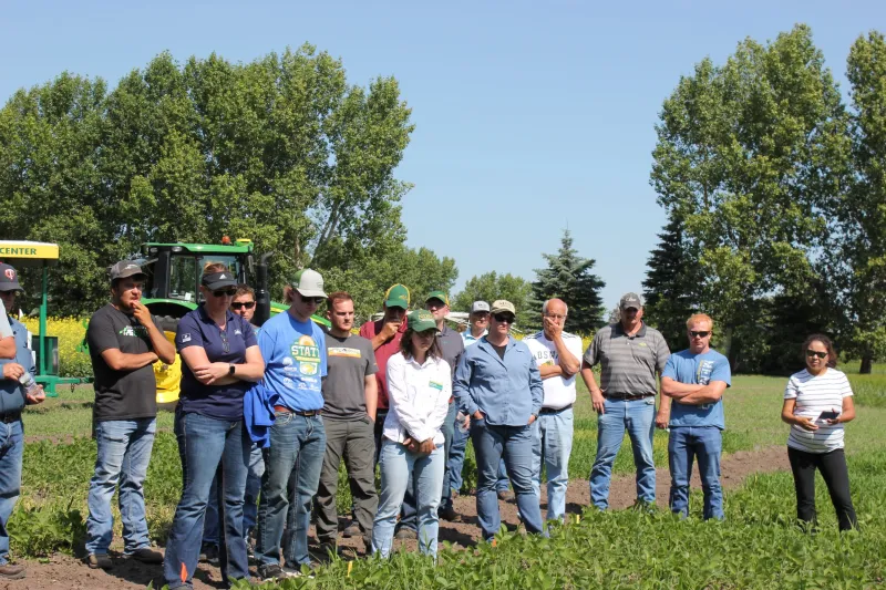 a group of people on a crops tour at LREC Field Day